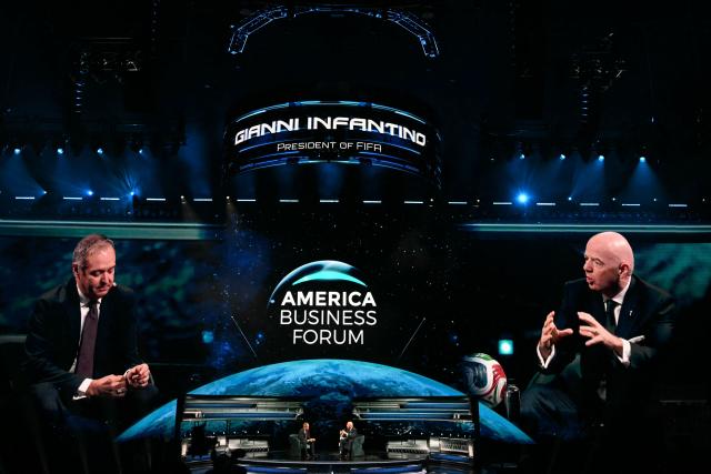 FIFA President Gianni Infantino (R) speaks at the American Business Forum at the Kaseya Center in Miami on November 5, 2025. (Photo by CHANDAN KHANNA / AFP)