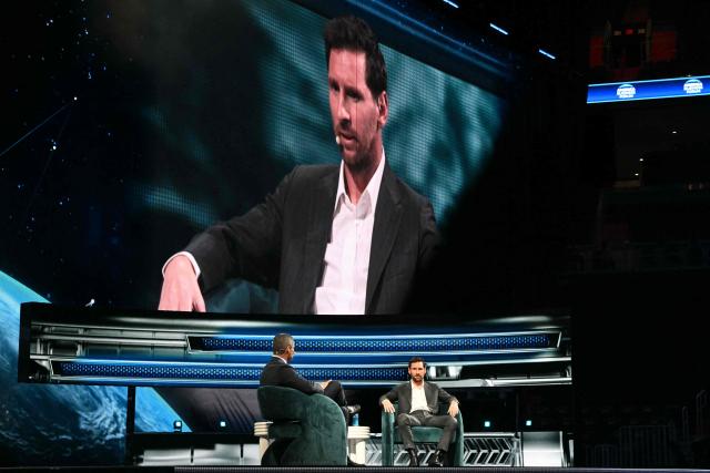Argentine soccer player Lionel Messi (R) and Miami Mayor Francis Suarez (L) speak at the American Business Forum at the Kaseya Center in Miami on November 5, 2025. (Photo by CHANDAN KHANNA / AFP)