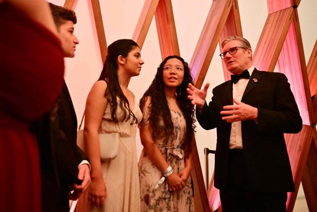 Britain's Prime Minister Keir Starmer talks with the finalists during a meeting ahead of the Earthshot Prize 2025 awards ceremony at the Museum of Tomorrow in Rio de Janeiro, Brazil on November 5, 2025. (Photo by Ben STANSALL / POOL / AFP)
