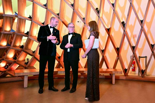 Britain's Prime Minister Keir Starmer and Britain’s Prince William, Prince of Wales, gesture during a meeting ahead of the Earthshot Prize 2025 awards ceremony at the Museum of Tomorrow in Rio de Janeiro, Brazil on November 5, 2025. (Photo by Ben STANSALL / POOL / AFP)