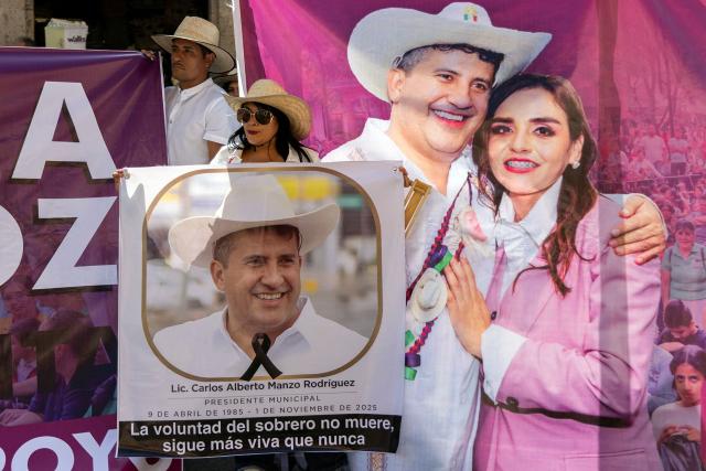 Supporters of the late Mayor Carlos Manzo gather outside the Michoacan State Congress during the swearing-in ceremony of his wife, Grecia Quiroz, as Mayor of Uruapan in Morelia, Michoacan State, Mexico on November 5, 2025. The Mexican government reported on November 2 that the mayor of Uruapan, Carlos Manzo, who was killed the previous night during a public event in the western state of Michoacan, had been under official protection since December last year. (Photo by Enrique Castro / AFP)