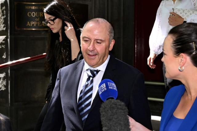 Tony Mokbel, one of the key figures in Melbourne's years-long gangland war, walks from the Victoria Supreme Court of Appeal in Melbourne on November 6, 2025. Mokbel has avoided any more jail time over a decades-old drug trafficking charge, a court ruled Thursday. (Photo by William WEST / AFP)