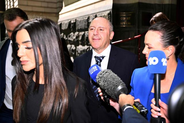 Tony Mokbel (C), one of the key figures in Melbourne's years-long gangland war, walks from the Victoria Supreme Court of Appeal in Melbourne on November 6, 2025. Mokbel has avoided any more jail time over a decades-old drug trafficking charge, a court ruled Thursday. (Photo by William WEST / AFP)