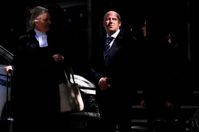 Tony Mokbel (C), one of the key figures in Melbourne's years-long gangland war, walks from the Victoria Supreme Court of Appeal in Melbourne on November 6, 2025. Mokbel has avoided any more jail time over a decades-old drug trafficking charge, a court ruled Thursday. (Photo by William WEST / AFP)