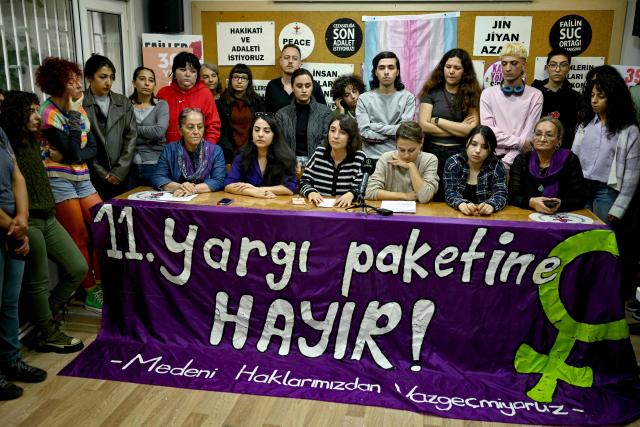 LGBT+ and women's associations deliver a press statement against the 11th judicial reform package in Istanbul on October 28, 2025. "If this law passes, it will threaten our very existence," sighs Florence while making last-minute hair and makeup adjustments before taking to the stage at one of Istanbul's LGBTQ nightclubs. At issue are proposed changes to the penal code made by Turkey's conservative Islamo-centric government which would allow for the prosecution of anyone who identifies as gay, bisexual or transgender by criminalising any behaviour deemed "contrary to biological sex and general morality". (Photo by Yasin AKGUL / AFP)