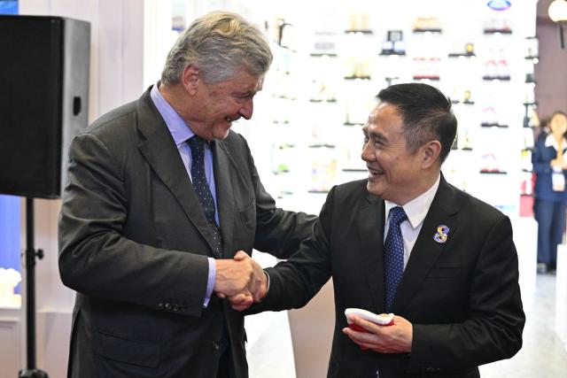 Deputy Minister for Foreign Trade Nicolas Forissier (L) and deputy director-general of the CIIE Bureau Wu Zhengping attend the inauguration of the pavillion of France during the 8th International Import Expo (CIIE) in Shanghai on November 6, 2025. (Photo by Hector RETAMAL / AFP)