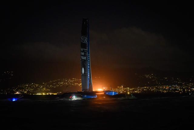 "SVR-LAZARTIGUE" ULTIM class multihull French skippers Franck Cammas and Tom Laperche, sail before to cross the finish line to win the 17th edition of the Transat Cafe L'Or, off the shores of Fort-de-France, in the French overseas island of Martinique on November 5, 2025. Four open classes will take part in the race: IMOCA, Ocean Fifty, ULTIM and Class40. The Transat Cafe L'Or is a duo sailing race from Le Havre to Fort-de-France, in the French Caribbean island of Martinique. (Photo by Loic VENANCE / AFP)