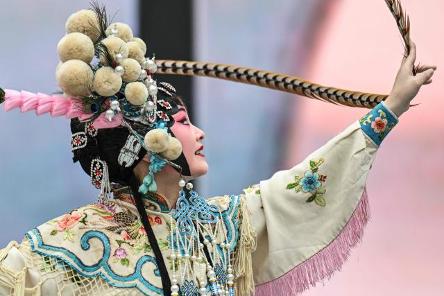 An actress performs in a Chinese Opera during the 8th International Import Expo (CIIE) in Shanghai on November 6, 2025. (Photo by Hector RETAMAL / AFP)