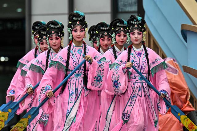 Actresses perform in Chinese Opera during the 8th International Import Expo (CIIE) in Shanghai on November 6, 2025. (Photo by Hector RETAMAL / AFP)