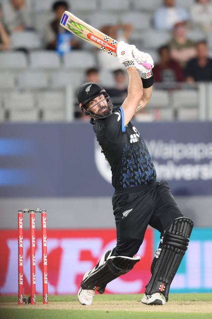 New Zealand’s Daryl Mitchell bats during the second Twenty20 international cricket match between New Zealand and West Indies played at Eden Park in Auckland on November 6, 2025. (Photo by Michael Bradley / AFP)