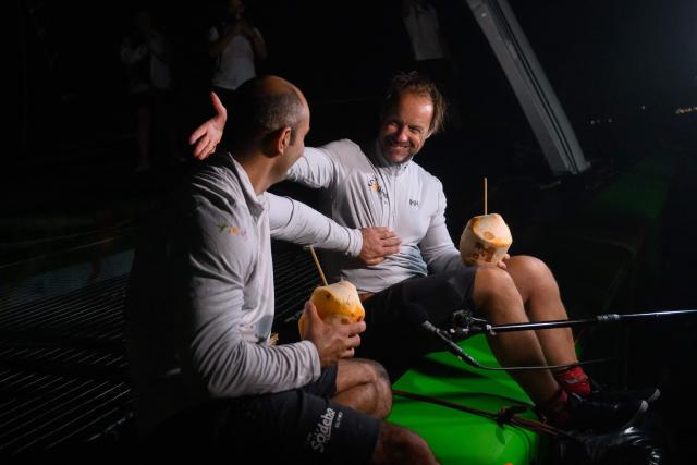 "Sodebo" ULTIM class multihull French skippers Thomas Coville (R) and Benjamin Schwartz celebrate after arriving second in the 17th edition of the Transat Cafe L'Or, off the shores of Fort-de-France, in the French overseas island of Martinique on November 6, 2025. Four open classes will take part in the race: IMOCA, Ocean Fifty, ULTIM and Class40. The Transat Cafe L'Or is a duo sailing race from Le Havre to Fort-de-France, in the French Caribbean island of Martinique. (Photo by Loic VENANCE / AFP)