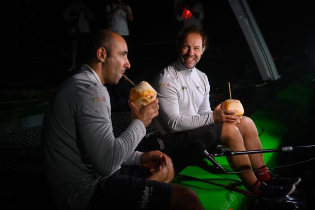 "Sodebo" ULTIM class multihull French skippers Thomas Coville (R) and Benjamin Schwartz celebrate after arriving second in the 17th edition of the Transat Cafe L'Or, off the shores of Fort-de-France, in the French overseas island of Martinique on November 6, 2025. Four open classes will take part in the race: IMOCA, Ocean Fifty, ULTIM and Class40. The Transat Cafe L'Or is a duo sailing race from Le Havre to Fort-de-France, in the French Caribbean island of Martinique. (Photo by Loic VENANCE / AFP)