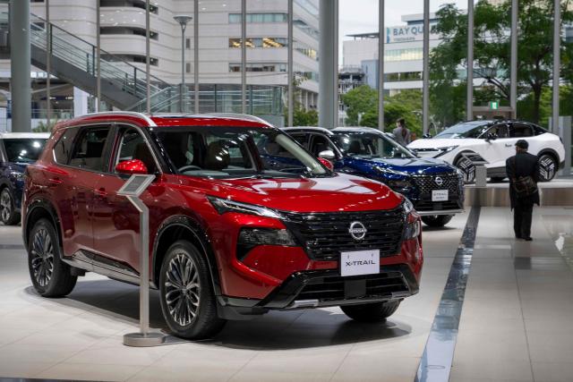 Nissan Motor's latest cars are displayed at the compnay's global headquarters showroom in Yokohama on November 6, 2025. Struggling Japanese automaker Nissan said on November 6 it was on the "path to recovery" even as it reported a hefty $690-million loss for the second quarter. (Photo by Kazuhiro NOGI / AFP)