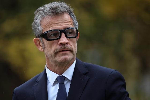 France's national rugby union team head coach Fabien Galthie arrives for a press conference to announce the team's composition ahead of the Autumn Nations Series international rugby union test match between France and South Africa, in Marcoussis, south of Paris, on November 6, 2025. (Photo by Anne-Christine POUJOULAT / AFP)