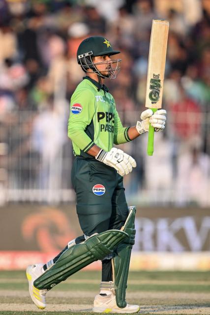 Pakistan's Saim Ayub celebrates after scoring a half-century (50 runs) during the second one-day international (ODI) cricket match between Pakistan and South Africa at the Iqbal Stadium in Faisalabad on November 6, 2025. (Photo by Aamir QURESHI / AFP)