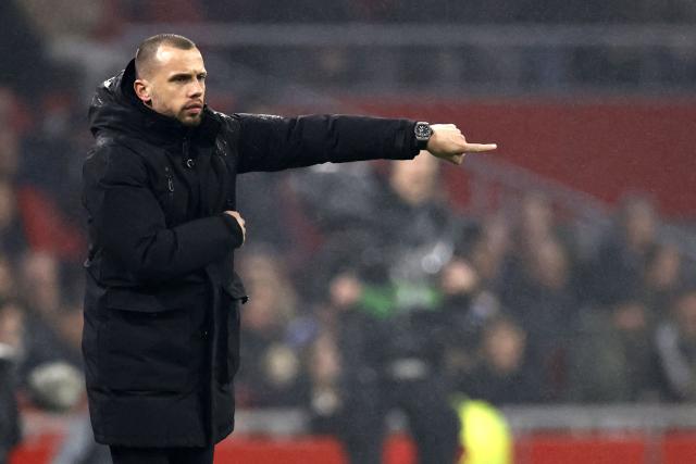 (FILES) Ajax' Dutch headcoach John Heitinga gestures during the UEFA Europa League first leg play off football match between Ajax Amsterdam (NED) and Union Berlin (GER) at the Johan Cruijff ArenA, in Amsterdam on February 16, 2023. Dutch giants Ajax said on November 6, 2025 they had sacked coach John Heitinga after a poor start to the season that has seen them rooted to the bottom of the Champions League table. (Photo by MAURICE VAN STEEN / ANP / AFP) / Netherlands OUT