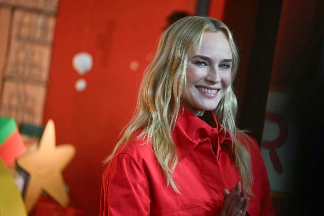 German actress Diane Kruger poses at the unveiling of the Christmas shop windows of the Printemps Haussmann department store in Paris, on November 6, 2025. (Photo by Julie SEBADELHA / AFP)