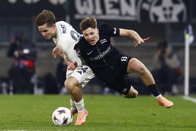 Nottingham Forest's English midfielder #24 James McAtee (L) and Sturm Graz's Polish midfielder #08 Filip Rozga vie for the ball during the UEFA Europa League football match between SK Sturm Graz and Nottingham Forest FC in Graz, Austria on November 6, 2025. (Photo by ERWIN SCHERIAU / APA / AFP) / Austria OUT
