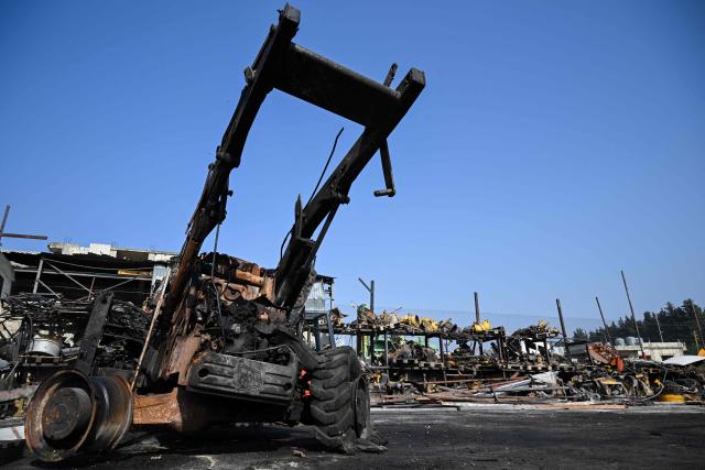 This photo taken on November 6, 2025 shows a burned construction vehicle at a site that was targeted in an Israeli strike in the southern Lebanese village of Ansaryeh. Israel struck Hezbollah targets in southern Lebanon on November 6, as the group rejected the prospect of direct political talks between the two countries and vowed to defend itself. (Photo by JOSEPH EID / AFP)