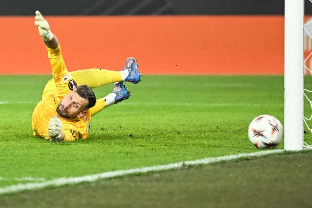 Steaua Bucharest’s Czech goalkeeper #38 Lukas Zima dives to stop the ball from entering the goal during the UEFA Europa League, league phase day 4, football match between FC Basel and FCS Bucarest at the St. Jakob-Park Stadium, in Basel, on November 6, 2025. (Photo by SEBASTIEN BOZON / AFP)