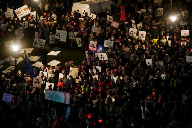 Thousands of demonstrators protest with banners and placards on November 6, 2025 at the Dome Square in Riga, against Latvia's bid to withdraw from the Istanbul Convention, designed to protect women from gender-based an domestic violence. Rights activists and Latvia's President had criticised the initial decision by lawmakers to pull out of the Convention. He returned the bill to the parliament for reconsideration on November 3, 2025, saying in a statement it "sent a contradictory message to both Latvian society and Latvia's allies". He also called for a national law on protecting women to be passed before taking a decision on leaving the Convention. (Photo by Gints Ivuskans / AFP)