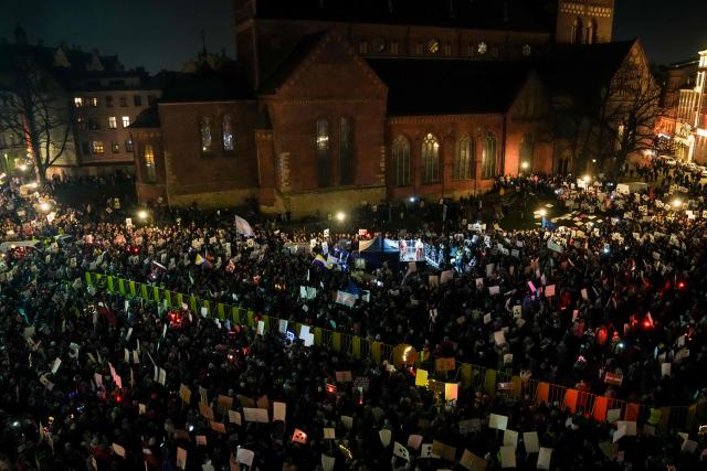 Thousands of demonstrators protest with banners and placards on November 6, 2025 at the Dome Square in Riga, against Latvia's bid to withdraw from the Istanbul Convention, designed to protect women from gender-based an domestic violence. Rights activists and Latvia's President had criticised the initial decision by lawmakers to pull out of the Convention. He returned the bill to the parliament for reconsideration on November 3, 2025, saying in a statement it "sent a contradictory message to both Latvian society and Latvia's allies". He also called for a national law on protecting women to be passed before taking a decision on leaving the Convention. (Photo by Gints Ivuskans / AFP)