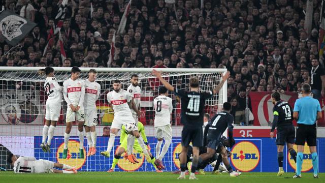 Stuttgart's players block the ball from Feyenoord's Algerian forward #23 Anis Hadj-Moussa (2R) during the UEFA Europa League football match between VfB Stuttgart and Feyenoord in Stuttgart, southwestern Germany on November 6, 2025. (Photo by THOMAS KIENZLE / AFP)