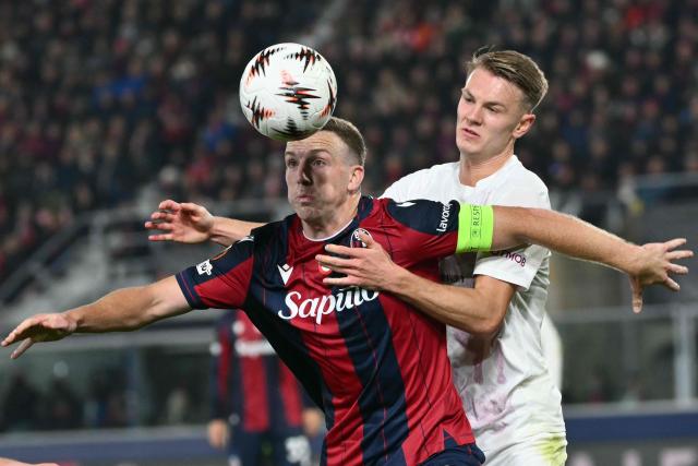 Bologna's Scottish midfielder #19 Lewis Ferguson fights for the ball with Brann Bergen's Danish midfielder #10 Emil Kornvig during the UEFA Europa League football match between Bologna and SK Brann Bergen at the Renato Dall'Ara stadium in Bologna on November 6, 2025. (Photo by Alberto PIZZOLI / AFP)