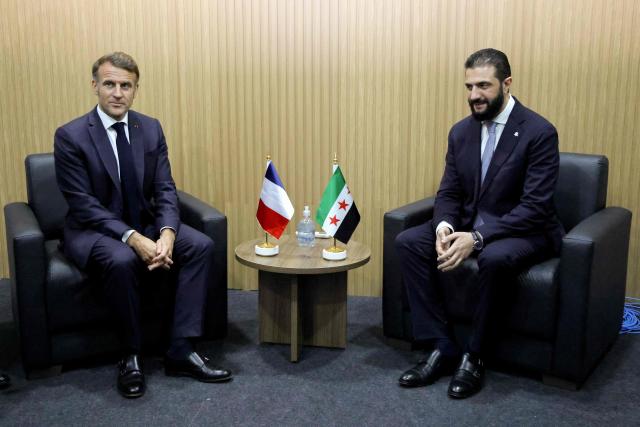France's President Emmanuel Macron and Syria's President Ahmad Al Sharaa look on during a bilateral meeting within the framework of the COP30 UN climate conference in Belem, Para State, Brazil on November 6, 2025. (Photo by Ludovic MARIN / AFP)