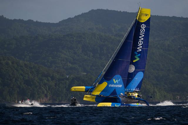 "Wewise" Ocean Fifty multihull French skippers Pierre Quiroga and Gaston Morvan sail to place second in the Ocean Fifty class 17th edition of the Transat Cafe L'Or, off the shores of Fort-de-France, in the French overseas island of Martinique on November 6, 2025. Four open classes take part in the race: IMOCA, Ocean Fifty, ULTIM and Class40. The Transat Cafe L'Or is a duo sailing race from Le Havre to Fort-de-France, in the French Caribbean island of Martinique. (Photo by Loic VENANCE / AFP)