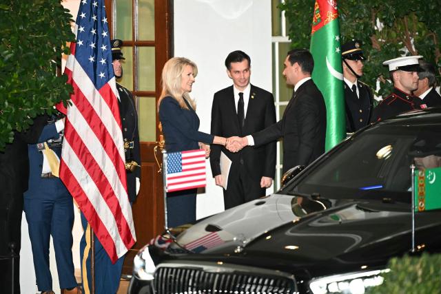 US Chief of Protocol Monica Crowley (L) greets Turkmenistan's President Serdar Berdimuhamedov (R) upon arrival at the West Wing of the White House in Washington, DC on November 6, 2025. US President Donald Trump is hosting a multilateral meeting with Central Asian countries. (Photo by Mandel NGAN / AFP)