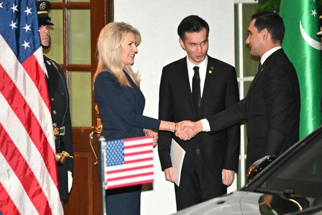 US Chief of Protocol Monica Crowley (L) greets Turkmenistan's President Serdar Berdimuhamedov (R) upon arrival at the West Wing of the White House in Washington, DC on November 6, 2025. US President Donald Trump is hosting a multilateral meeting with Central Asian countries. (Photo by Mandel NGAN / AFP)
