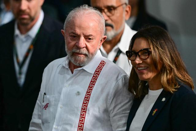 Brazil's President Luiz Inacio Lula da Silva and his wife Rosangela da Silva are seen during the COP30 UN climate conference in Belem, Para State, Brazil on November 6, 2025. (Photo by Pablo PORCIUNCULA / AFP)