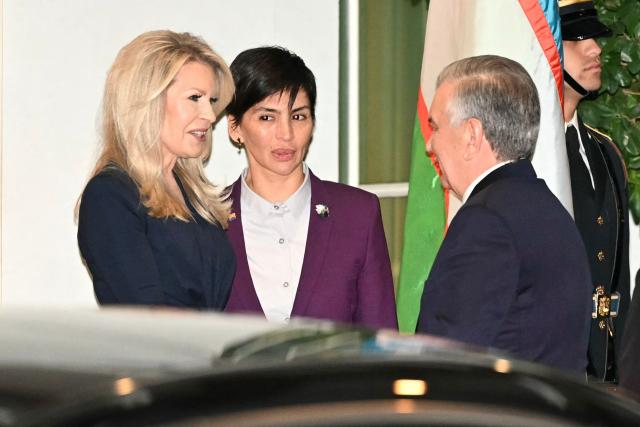 US Chief of Protocol Monica Crowley (L) greets Uzbekistan's president Shavkat Mirziyoyev (R) upon arrival at the West Wing of the White House in Washington, DC on November 6, 2025. US President Donald Trump is hosting a multilateral meeting with Central Asian countries. (Photo by Mandel NGAN / AFP)