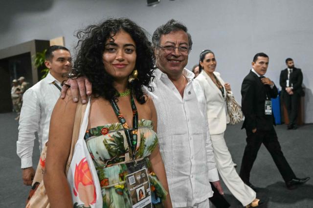 Colombia's President Gustavo Petro and his daughter Sofia are seen during the COP30 UN climate conference in Belem, Para State, Brazil on November 6, 2025. (Photo by Mauro PIMENTEL / AFP)
