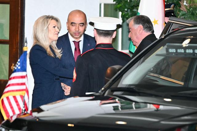 US Chief of Protocol Monica Crowley (L) greets Tajikistan's President Emomali Rahmon (R) upon arrival at the West Wing of the White House in Washington, DC on November 6, 2025. US President Donald Trump is hosting a multilateral meeting with Central Asian countries. (Photo by Mandel NGAN / AFP)