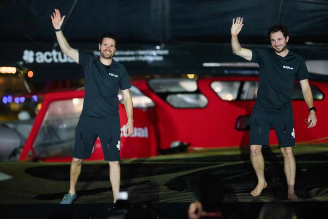 "Actual" Ultim multihull French skippers Julien Villion (R) and Anthony Marchand celebrate after placing third in the Ultim class of 17th edition of the Transat Cafe L'Or, off the shores of Fort-de-France, in the French overseas island of Martinique on November 6, 2025. Four open classes take part in the race: IMOCA, Ocean Fifty, ULTIM and Class40. The Transat Cafe L'Or is a duo sailing race from Le Havre to Fort-de-France, in the French Caribbean island of Martinique. (Photo by Loic VENANCE / AFP)