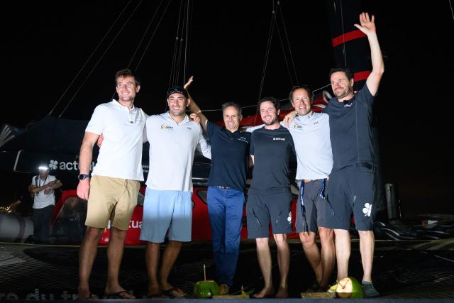 French skippers, SVR-Lazartigue's Tom Laperche (L) and Franck Cammas, first, Sodebo's Benjamin Schwartz (2ndL) and Thomas Coville (2ndR), second, and Actual's Julien Villion (3dR) and Anthony Marchand (R), third, the podium of the Ultim class of 17th edition of the Transat Cafe L'Or, pose in Fort-de-France, in the French overseas island of Martinique on November 6, 2025. Four open classes take part in the race: IMOCA, Ocean Fifty, ULTIM and Class40. The Transat Cafe L'Or is a duo sailing race from Le Havre to Fort-de-France, in the French Caribbean island of Martinique. (Photo by Loic VENANCE / AFP)