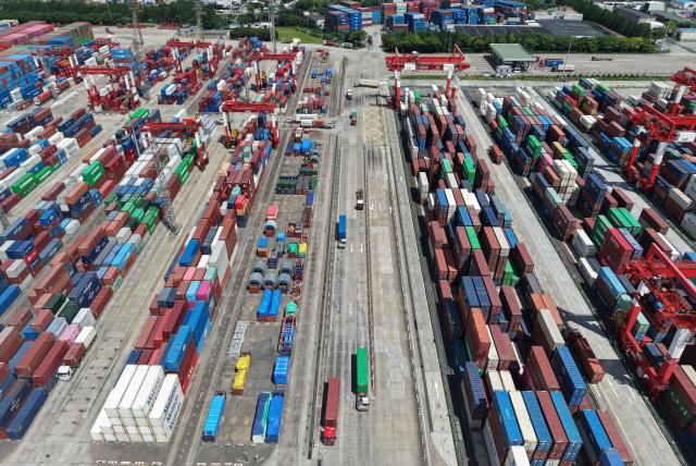 This aerial photo shows containers at the Shanghai international port in Shanghai on November 7, 2025. (Photo by AFP) / China OUT