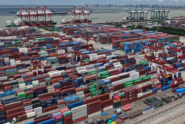 This aerial photo shows containers at the Shanghai international port in Shanghai on November 7, 2025. (Photo by AFP) / China OUT