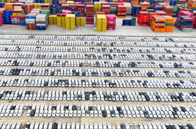 This aerial photo shows cars waiting to be loaded for export in Nanjing port, Nanjing, eastern China's Jiangsu province on November 6, 2025. (Photo by AFP) / China OUT
