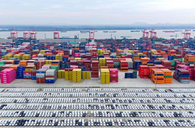 This aerial photo shows cars waiting to be loaded for export in Nanjing port, Nanjing, eastern China's Jiangsu province on November 6, 2025. (Photo by AFP) / China OUT