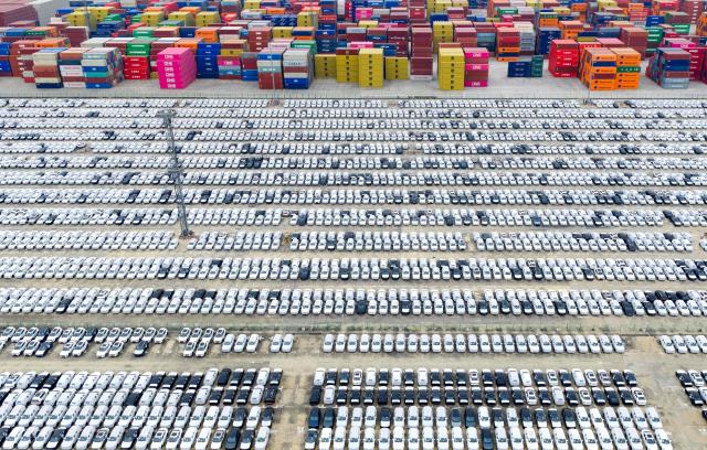This aerial photo shows cars waiting to be loaded for export in Nanjing port, Nanjing, eastern China's Jiangsu province on November 6, 2025. (Photo by AFP) / China OUT