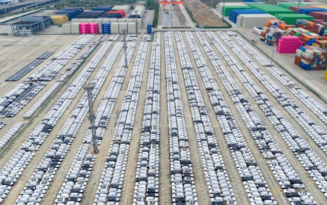 This aerial photo shows cars waiting to be loaded for export in Nanjing port, Nanjing, eastern China's Jiangsu province on November 6, 2025. (Photo by AFP) / China OUT