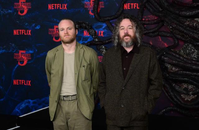 Composers Michael Stein (L) and Kyle Dixon attend the world premiere of Netflix's "Stranger Things", Season 5, at the TCL Chinese theatre in Los Angeles on November 6, 2025. (Photo by Frederic J. BROWN / AFP)