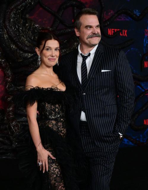 British actress Millie Bobby Brown and US actor David Harbour attend the world premiere of Netflix's "Stranger Things", Season 5, at the TCL Chinese theatre in Los Angeles on November 6, 2025. (Photo by Frederic J. BROWN / AFP)