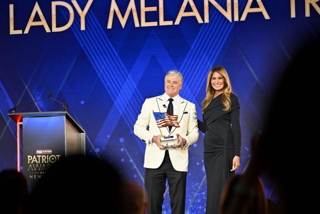 US First Lady Melania Trump accepts the Patriot of the Year Award from US conservative broadcaster Sean Hannity onstage during the 2025 Fox Nation Patriot Awards at Tilles Center for the Performing Arts on November 6, 2025 in Greenvale, New York. (Photo by Roy Rochlin / POOL / AFP)