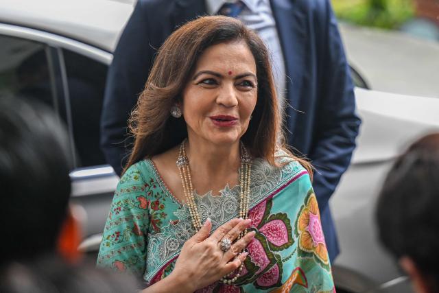 Nita Ambani, wife of billionaire tycoon Mukesh Ambani and Founder Chairperson of the Reliance Foundation, arrives to attend the listing ceremony of Piramal Finance's initial public offering (IPO) at the National Stock Exchange (NSE) in Mumbai on November 7, 2025. (Photo by Punit PARANJPE / AFP)