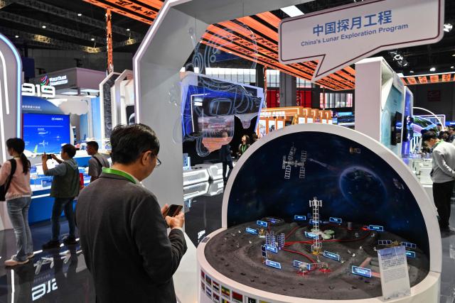 A model of China's Lunar exploration program is displayed during the 8th International Import Expo (CIIE) in Shanghai on November 7, 2025. (Photo by Hector RETAMAL / AFP)