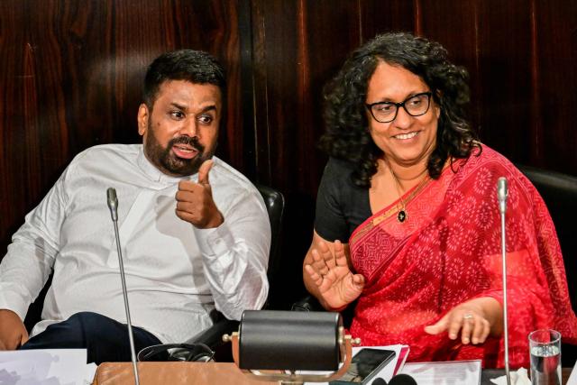 Sri Lanka's President Anura Kumara Dissanayake (L) gestures after presenting the 2026 budget to parliament as Prime Minister Harini Amarasuriya watches in Colombo on November 7, 2025. (Photo by Ishara S. KODIKARA / AFP)